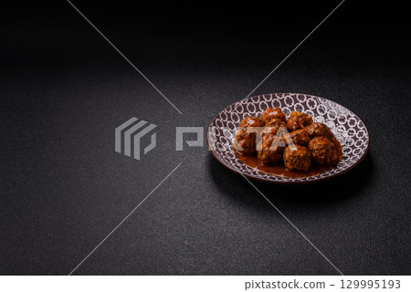 Meat, meatballs in tomato sauce, Italian food, beef or pork with salt . Meatballs with tomatoes 129995193