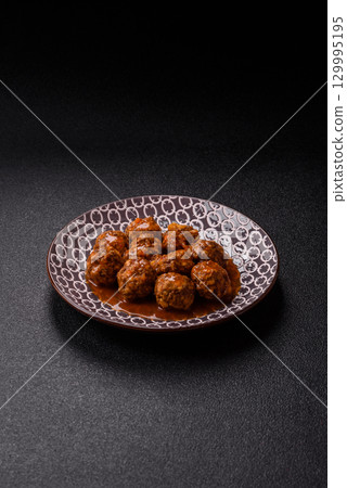 Meat, meatballs in tomato sauce, Italian food, beef or pork with salt . Meatballs with tomatoes Meat, meatballs in tomato sauce, Italian food, beef or pork with salt . Meatballs with tomatoes 129995195