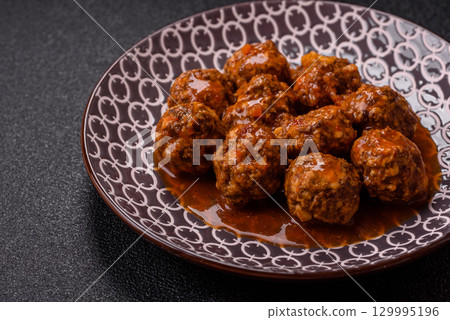 Meat, meatballs in tomato sauce, Italian food, beef or pork with salt . Meatballs with tomatoes 129995196