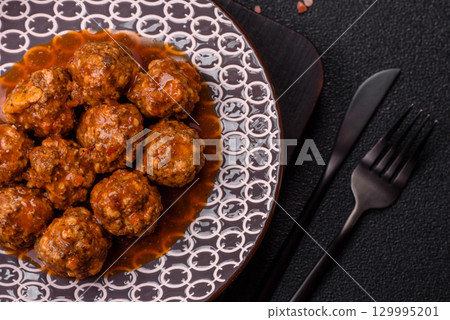Meat, meatballs in tomato sauce, Italian food, beef or pork with salt . Meatballs with tomatoes Meat, meatballs in tomato sauce, Italian food, beef or pork with salt . Meatballs with tomatoes 129995201