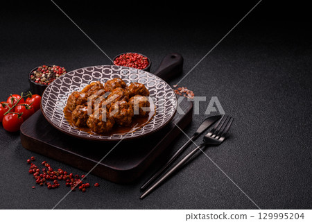 Meat, meatballs in tomato sauce, Italian food, beef or pork with salt . Meatballs with tomatoes 129995204