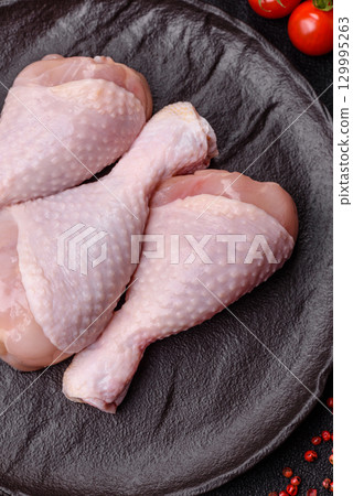 Raw chicken legs, fresh uncooked poultry meat. Chicken or turkey legs Raw chicken legs, fresh uncooked poultry meat. Chicken or turkey legs 129995263