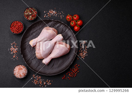 Raw chicken legs, fresh uncooked poultry meat. Chicken or turkey legs Raw chicken legs, fresh uncooked poultry meat. Chicken or turkey legs 129995266