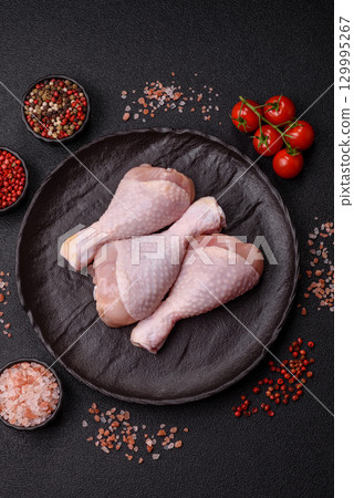 Raw chicken legs, fresh uncooked poultry meat. Chicken or turkey legs Raw chicken legs, fresh uncooked poultry meat. Chicken or turkey legs 129995267