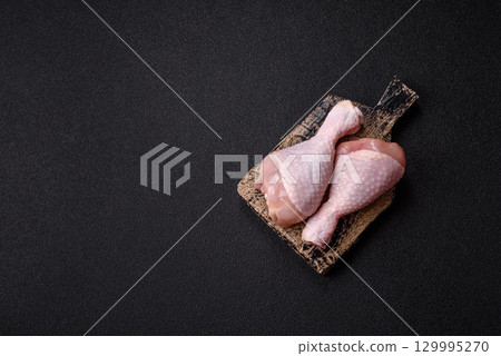 Raw chicken legs, fresh uncooked poultry meat. Chicken or turkey legs Raw chicken legs, fresh uncooked poultry meat. Chicken or turkey legs 129995270