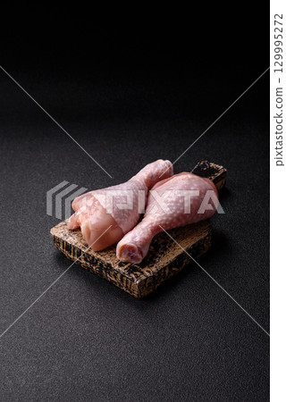 Raw chicken legs, fresh uncooked poultry meat. Chicken or turkey legs 129995272