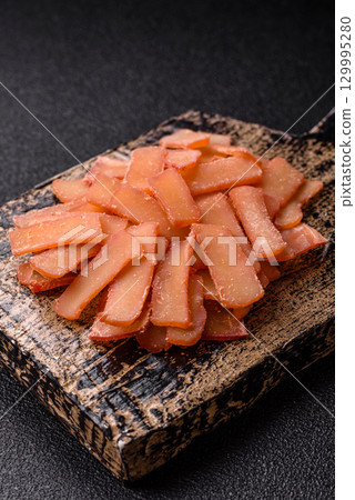 Food, dried squid in shavings or chopped as snacks or jerky. Snack dried squid for beer 129995280