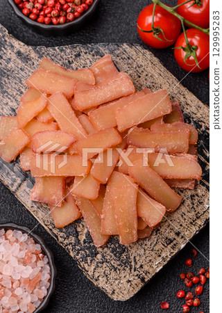 Food, dried squid in shavings or chopped as snacks or jerky. Snack dried squid for beer Food, dried squid in shavings or chopped as snacks or jerky. Snack dried squid for beer 129995283