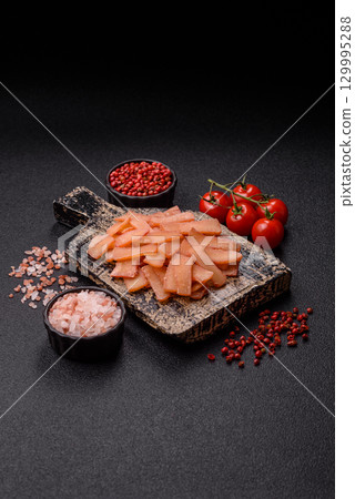 Food, dried squid in shavings or chopped as snacks or jerky. Snack dried squid for beer Food, dried squid in shavings or chopped as snacks or jerky. Snack dried squid for beer 129995288