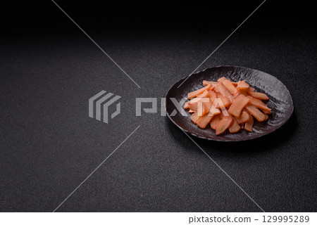 Food, dried squid in shavings or chopped as snacks or jerky. Snack dried squid for beer Food, dried squid in shavings or chopped as snacks or jerky. Snack dried squid for beer 129995289