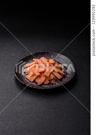 Food, dried squid in shavings or chopped as snacks or jerky. Snack dried squid for beer Food, dried squid in shavings or chopped as snacks or jerky. Snack dried squid for beer 129995292