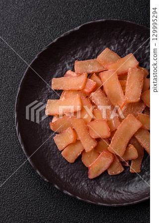 Food, dried squid in shavings or chopped as snacks or jerky. Snack dried squid for beer Food, dried squid in shavings or chopped as snacks or jerky. Snack dried squid for beer 129995294