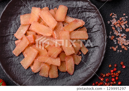 Food, dried squid in shavings or chopped as snacks or jerky. Snack dried squid for beer Food, dried squid in shavings or chopped as snacks or jerky. Snack dried squid for beer 129995297