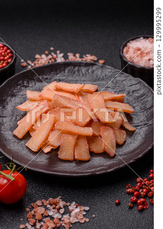 Food, dried squid in shavings or chopped as snacks or jerky. Snack dried squid for beer 129995299