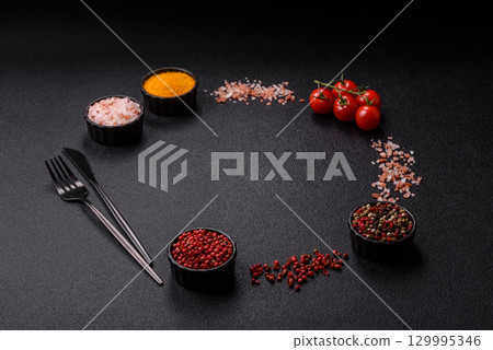 Ingredients for cooking cherry tomatoes, salt, spices and herbs Ingredients for cooking cherry tomatoes, salt, spices and herbs 129995346
