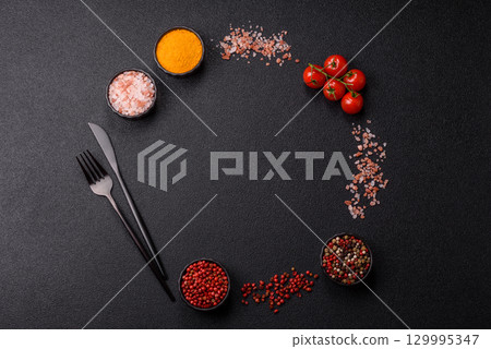Ingredients for cooking cherry tomatoes, salt, spices and herbs Ingredients for cooking cherry tomatoes, salt, spices and herbs 129995347