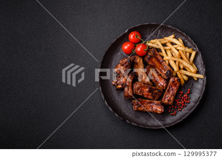 Meat, beef ribs in a marinade grilled with salt and spices. Grilled ribs 129995377