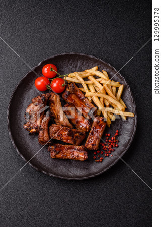 Meat, beef ribs in a marinade grilled with salt and spices. Grilled ribs 129995378