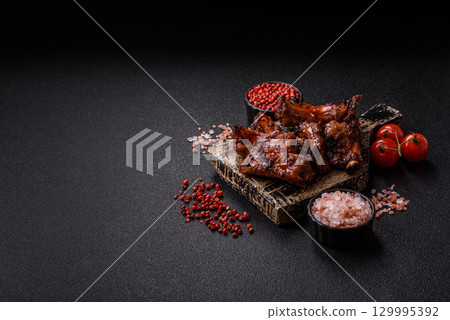 Meat, beef ribs in a marinade grilled with salt and spices. Grilled ribs 129995392
