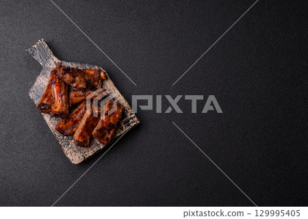 Meat, beef ribs in a marinade grilled with salt and spices. Grilled ribs 129995405