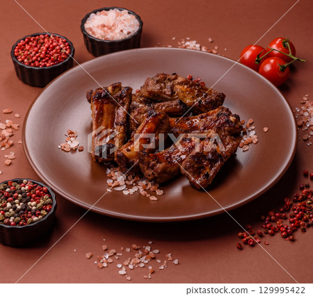 Meat, beef ribs in a marinade grilled with salt and spices. Grilled ribs 129995422
