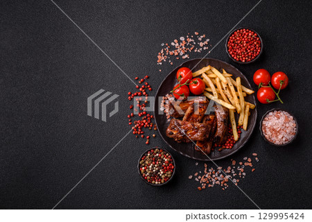 Meat, beef ribs in a marinade grilled with salt and spices. Grilled ribs 129995424