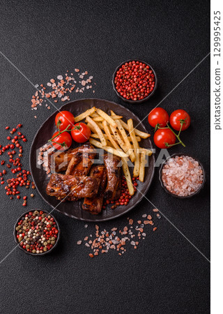 Meat, beef ribs in a marinade grilled with salt and spices. Grilled ribs 129995425