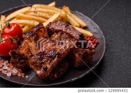 Meat, beef ribs in a marinade grilled with salt and spices. Grilled ribs 129995431