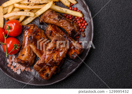 Meat, beef ribs in a marinade grilled with salt and spices. Grilled ribs 129995432