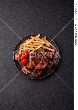 Meat, beef ribs in a marinade grilled with salt and spices. Grilled ribs 129995437