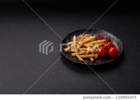 Food, French fries fried with salt and rosemary. Homemade crispy chips Food, French fries fried with salt and rosemary. Homemade crispy chips 129995455