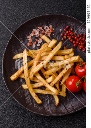 Food, French fries fried with salt and rosemary. Homemade crispy chips 129995461