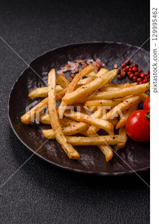 Food, French fries fried with salt and rosemary. Homemade crispy chips 129995462