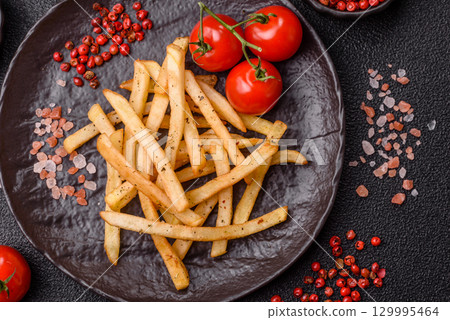 Food, French fries fried with salt and rosemary. Homemade crispy chips Food, French fries fried with salt and rosemary. Homemade crispy chips 129995464
