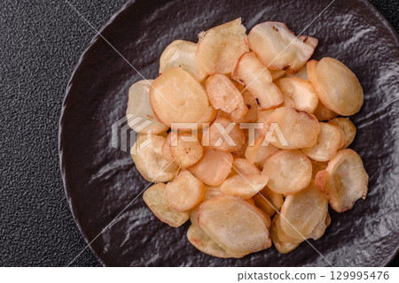 Food, dried squid in shavings or chopped as snacks or jerky. Snack dried squid for beer Food, dried squid in shavings or chopped as snacks or jerky. Snack dried squid for beer 129995476