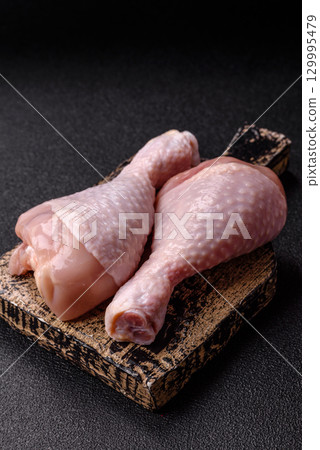 Raw chicken legs, fresh uncooked poultry meat. Chicken or turkey legs Raw chicken legs, fresh uncooked poultry meat. Chicken or turkey legs 129995479