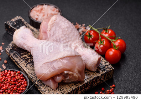 Raw chicken legs, fresh uncooked poultry meat. Chicken or turkey legs Raw chicken legs, fresh uncooked poultry meat. Chicken or turkey legs 129995480