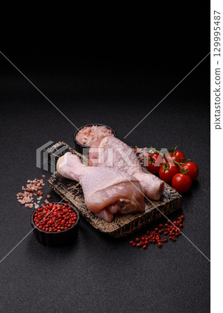 Raw chicken legs, fresh uncooked poultry meat. Chicken or turkey legs Raw chicken legs, fresh uncooked poultry meat. Chicken or turkey legs 129995487