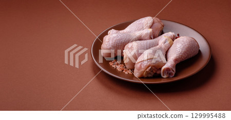 Raw chicken legs, fresh uncooked poultry meat. Chicken or turkey legs Raw chicken legs, fresh uncooked poultry meat. Chicken or turkey legs 129995488