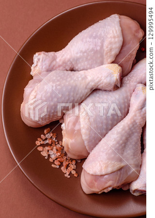 Raw chicken legs, fresh uncooked poultry meat. Chicken or turkey legs 129995494