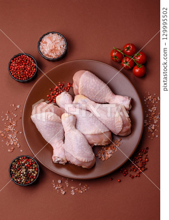 Raw chicken legs, fresh uncooked poultry meat. Chicken or turkey legs 129995502