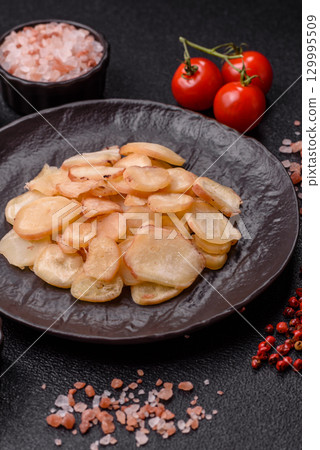 Food, dried squid in shavings or chopped as snacks or jerky. Snack dried squid for beer 129995509