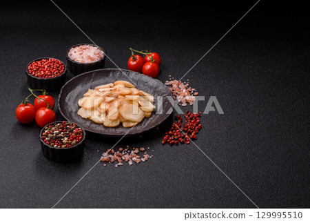 Food, dried squid in shavings or chopped as snacks or jerky. Snack dried squid for beer Food, dried squid in shavings or chopped as snacks or jerky. Snack dried squid for beer 129995510