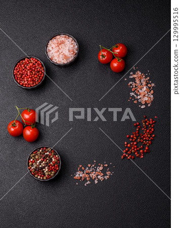 Ingredients for cooking cherry tomatoes, salt, spices and herbs 129995516