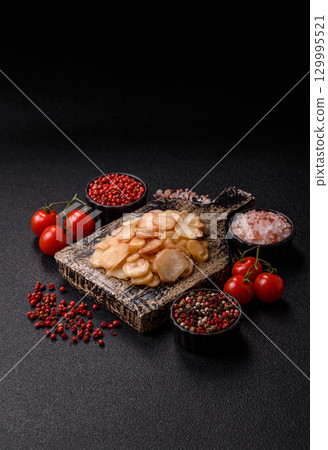 Food, dried squid in shavings or chopped as snacks or jerky. Snack dried squid for beer Food, dried squid in shavings or chopped as snacks or jerky. Snack dried squid for beer 129995521