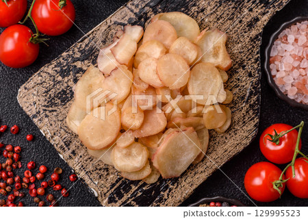 Food, dried squid in shavings or chopped as snacks or jerky. Snack dried squid for beer Food, dried squid in shavings or chopped as snacks or jerky. Snack dried squid for beer 129995523