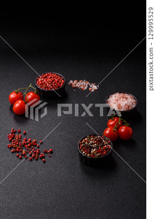 Ingredients for cooking cherry tomatoes, salt, spices and herbs Ingredients for cooking cherry tomatoes, salt, spices and herbs 129995529