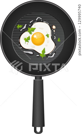 Sunny-side up egg in a frying pan garnished with fresh parsley, ready for a delicious breakfast. 129995740