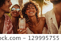 A group of happy friends cheers with champagne, laughing and enjoying the sunset. A joyful gathering of people, sharing laughter and drinks, capturing a moment of celebration This is AI-generated item 129995755