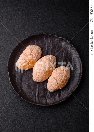 Steamed fish or chicken cutlets or meatballs with salt and spices. Fish cutlets 129995872